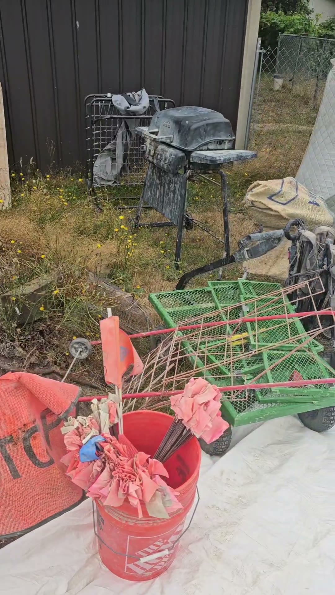 A dusty gas barbecue on a stand