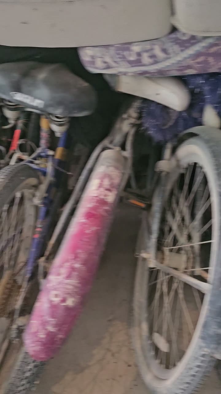 More burner bikes leaning in the barn