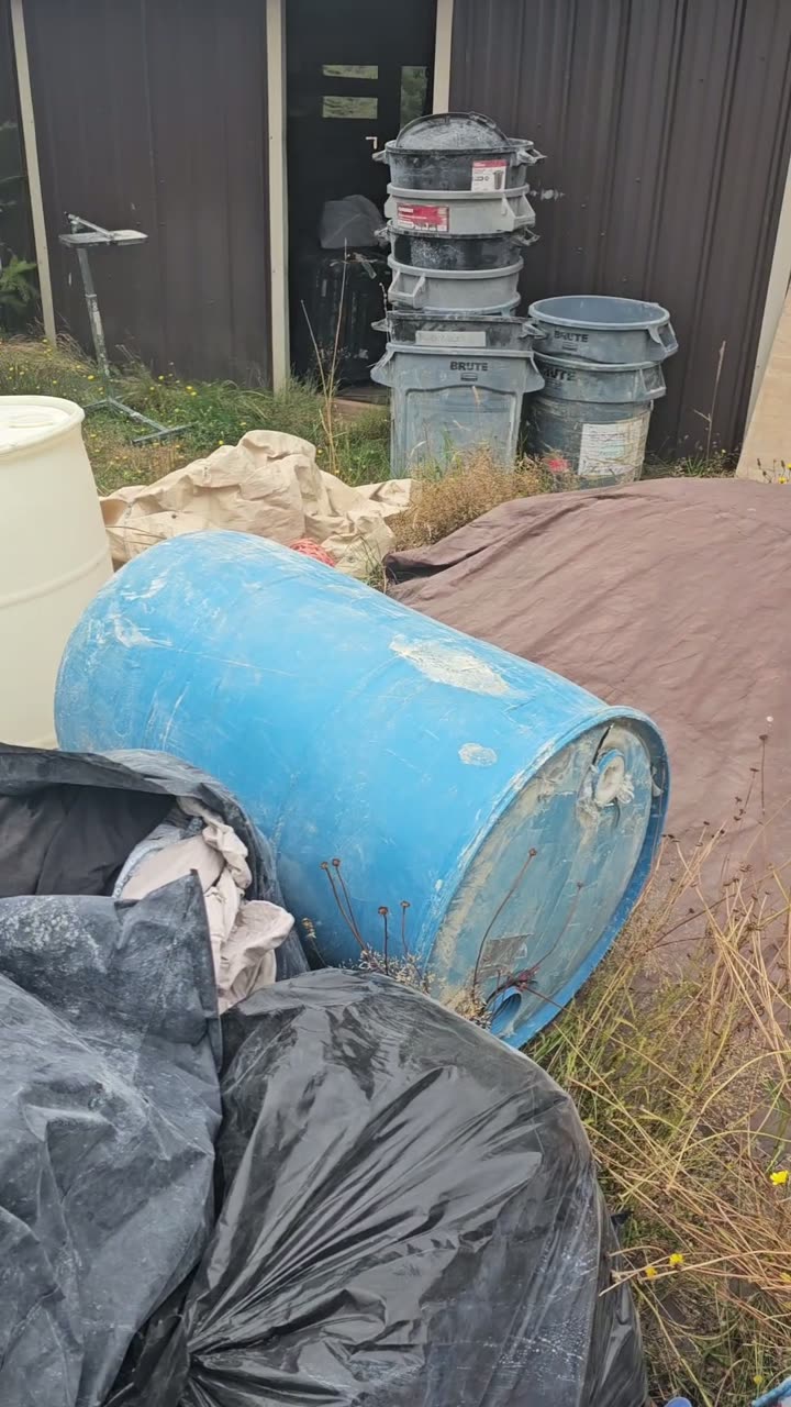 Two 55 gallon water drums