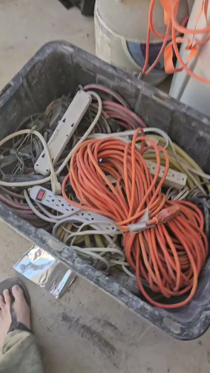 A tote full of extension cords and power strips