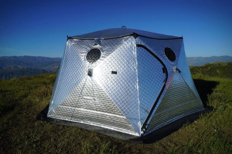 A set-up ShiftPod 2 with a stack of mattresses inside