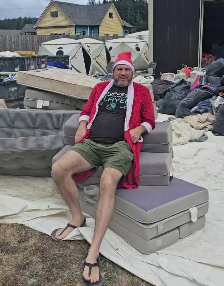 Santa sitting on the twin trifold couch